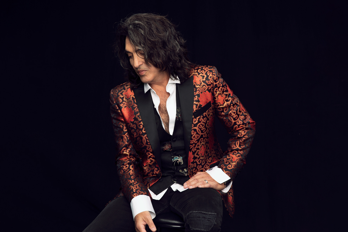 Paul Stanley sits in a flamboyant jacket to promote Soul Station